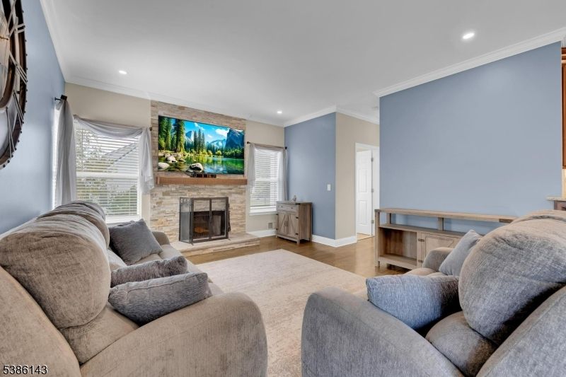 Fireplace, Interior, Living room, Recessed Lighting, Stone Walls, Wood Texture Flooring