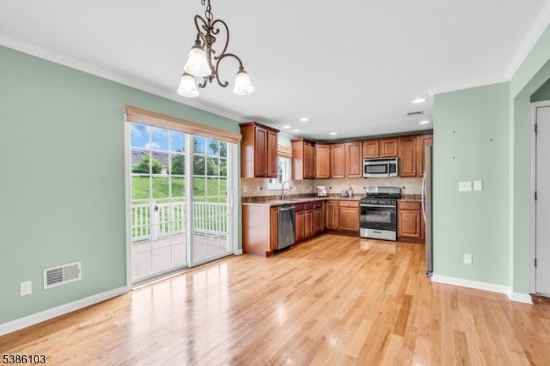 Chandelier, Interior, Kitchen, Recessed Lighting, Stainless Steel Appliances, Wood Texture Flooring