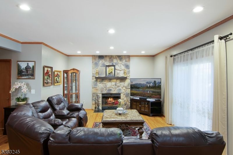 Fireplace, Interior, Living room, Recessed Lighting, Stone Walls, Wood Texture Flooring