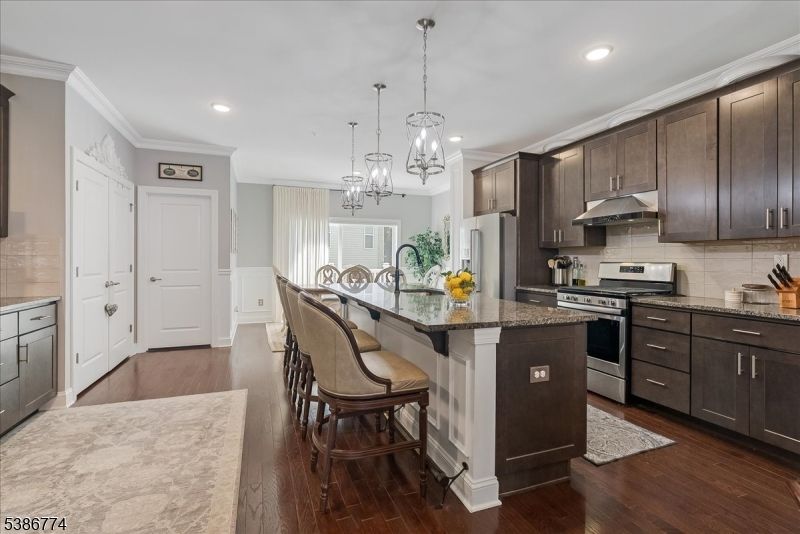 Chandelier, Interior, Kitchen, Pendant Lights, Recessed Lighting, Stainless Steel Appliances, Wood Texture Flooring