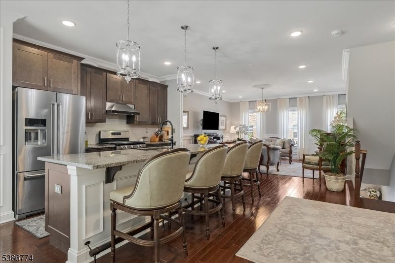 Chandelier, Dining room, Interior, Kitchen, Pendant Lights, Recessed Lighting, Stainless Steel Appliances, Wood Texture Flooring