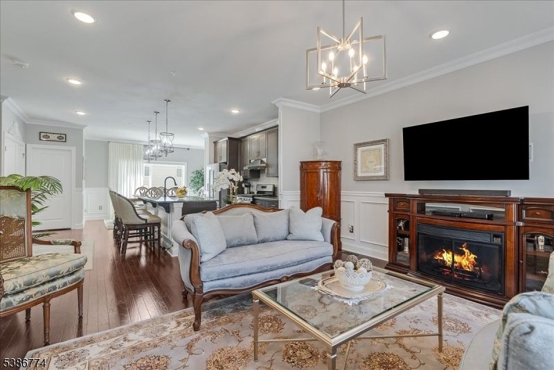 Chandelier, Dining room, Fireplace, Interior, Kitchen, Living room, Pendant Lights, Recessed Lighting, Wood Texture Flooring