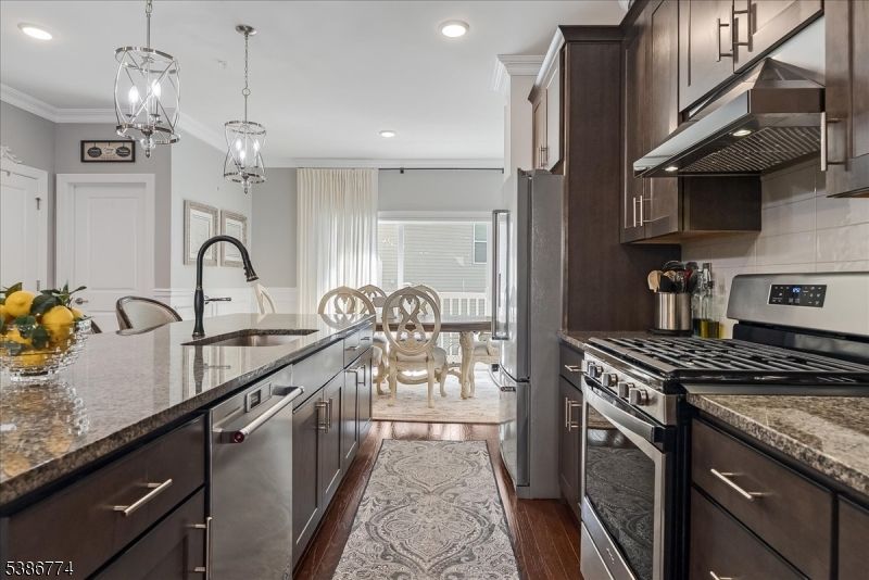 Dining room, Interior, Kitchen, Pendant Lights, Recessed Lighting, Stainless Steel Appliances, Wood Texture Flooring