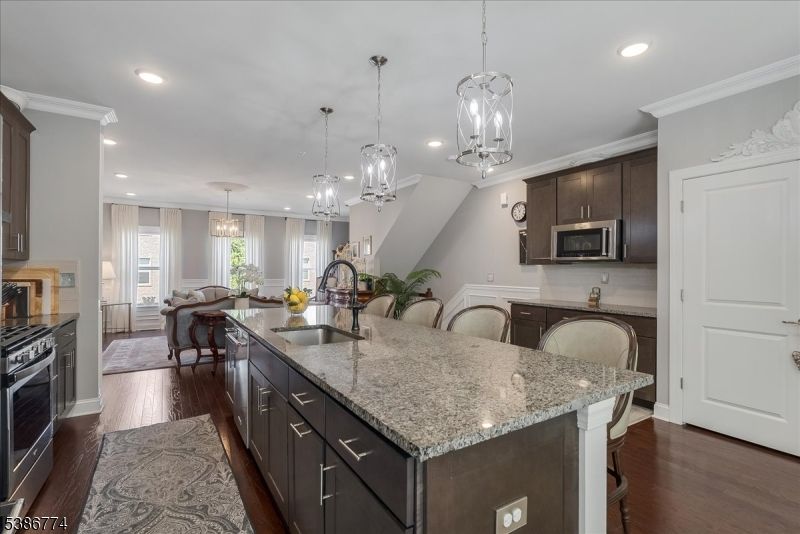 Chandelier, Dining room, Interior, Kitchen, Pendant Lights, Recessed Lighting, Stainless Steel Appliances, Wood Texture Flooring