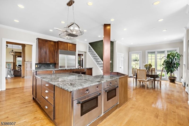 Chandelier, Dining room, Interior, Kitchen, Pendant Lights, Recessed Lighting, Stainless Steel Appliances, Wood Texture Flooring