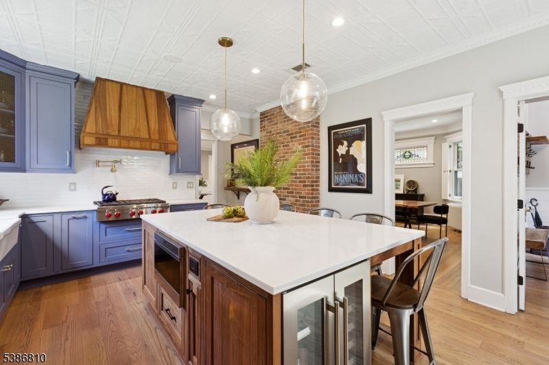 Interior, Kitchen, Pendant Lights, Recessed Lighting, Stainless Steel Appliances, Stone Walls, Wood Texture Flooring