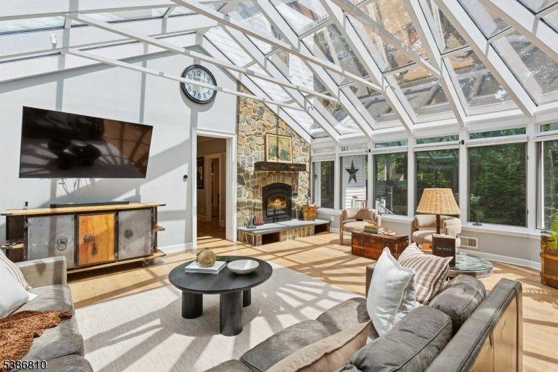Fireplace, Glass Ceilings, Interior, Living room, Stone Walls, Sun Room, Wood Texture Flooring