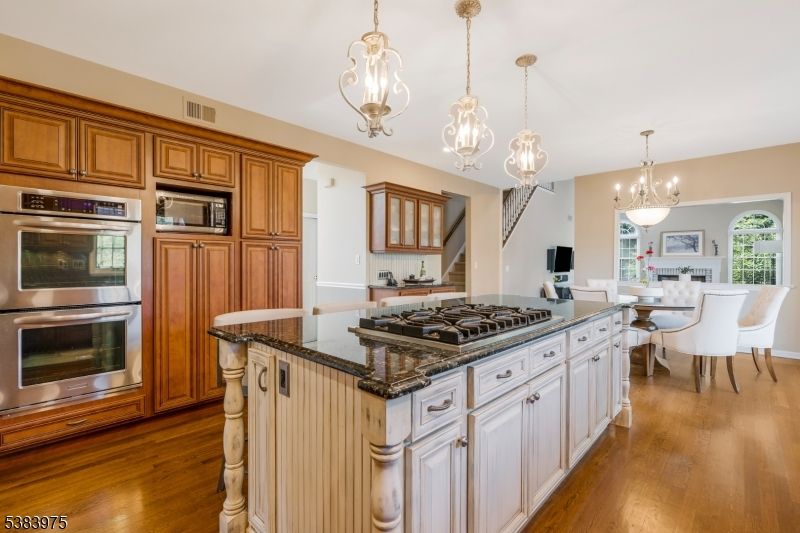 Chandelier, Dining room, Interior, Kitchen, Pendant Lights, Stainless Steel Appliances, Wood Texture Flooring