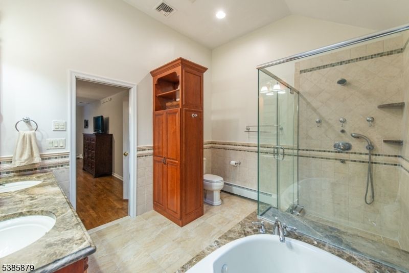Bathroom, Dual Sink Vanities, Glass Shower, Interior, Recessed Lighting, Wood Texture Flooring