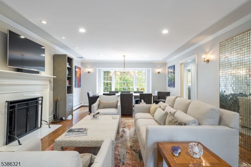 Dining room, Fireplace, Interior, Living room, Pendant Lights, Recessed Lighting, Wood Texture Flooring