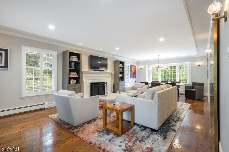Dining room, Fireplace, Interior, Living room, Pendant Lights, Recessed Lighting, Wood Texture Flooring