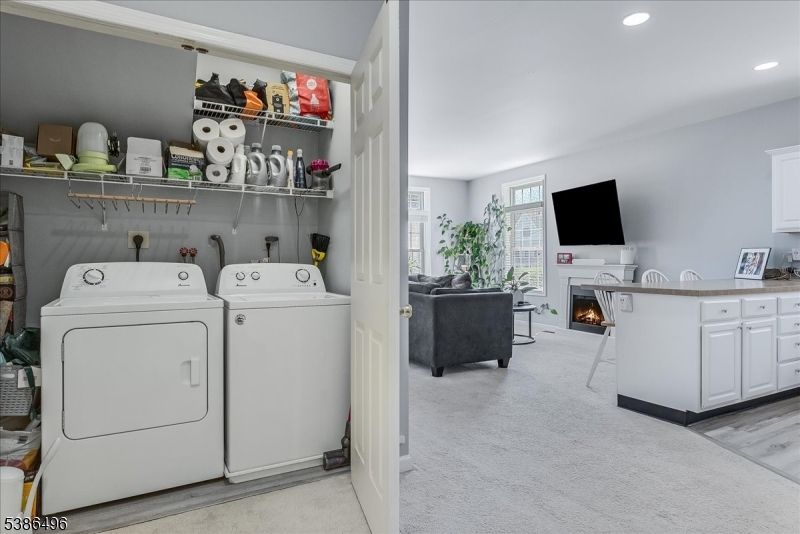 Fireplace, Interior, Living room, Recessed Lighting, Utility Closets, Washer, Wood Texture Flooring