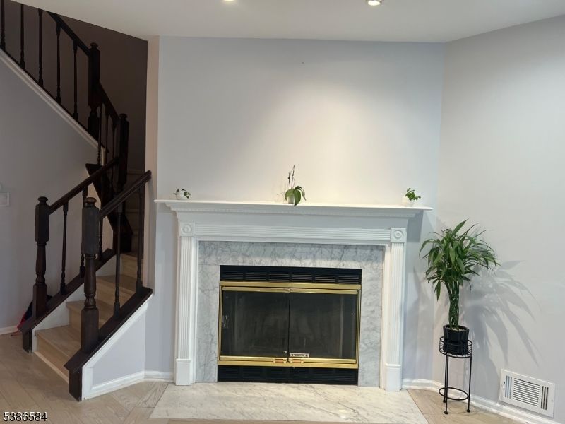 Fireplace, Interior, Marble, Recessed Lighting, Wood Texture Flooring