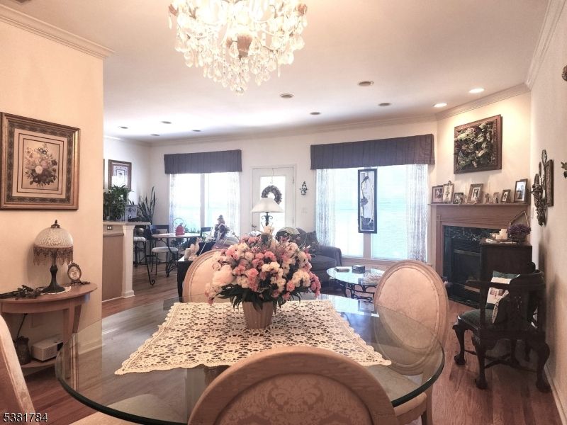 Chandelier, Dining room, Fireplace, Interior, Living room, Recessed Lighting, Wood Texture Flooring