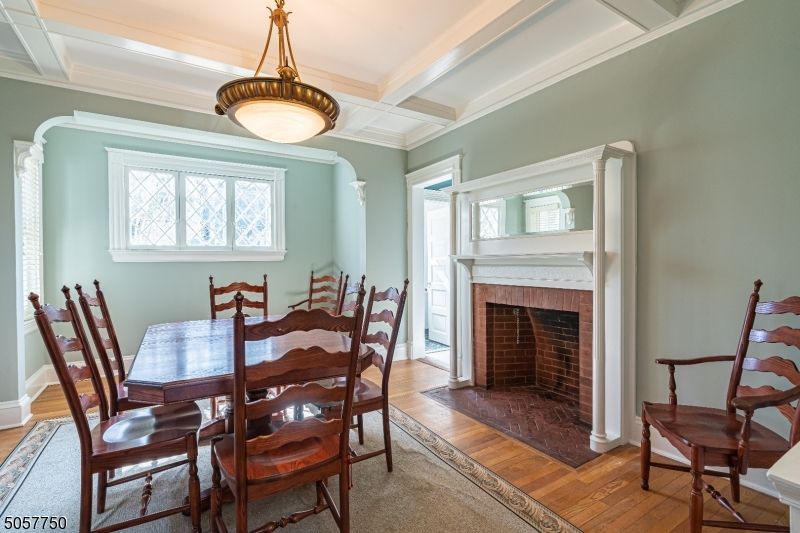 Dining room, Fireplace, Interior, Pendant Lights, Wood Texture Flooring