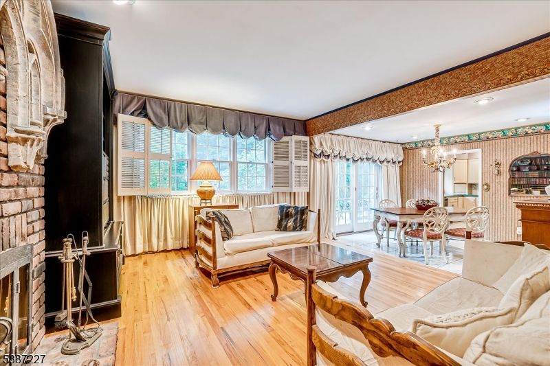 Chandelier, Dining room, Fireplace, Interior, Living room, Recessed Lighting, Wood Texture Flooring