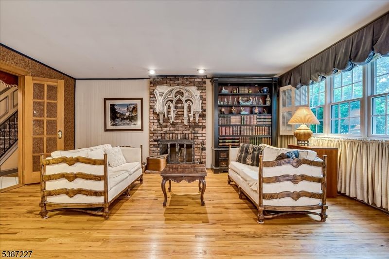 Fireplace, Interior, Living room, Recessed Lighting, Stone Walls, Wood Texture Flooring