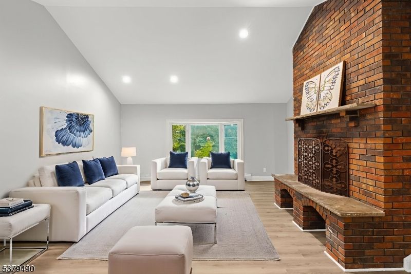 Fireplace, Interior, Living room, Recessed Lighting, Stone Walls, Wood Texture Flooring