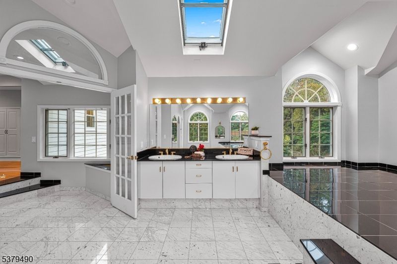 Bathroom, Dual Sink Vanities, Glass Ceilings, Interior, Marble, Recessed Lighting