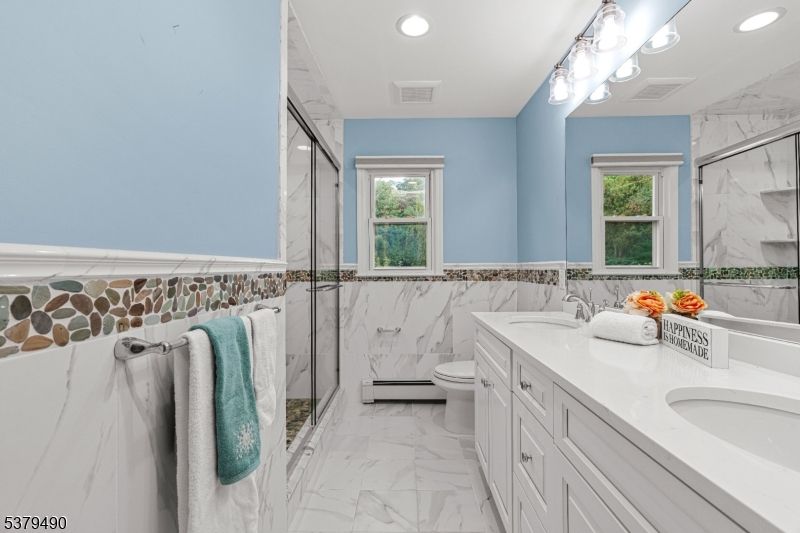 Bathroom, Dual Sink Vanities, Glass Shower, Interior, Marble, Marble Walls, Recessed Lighting