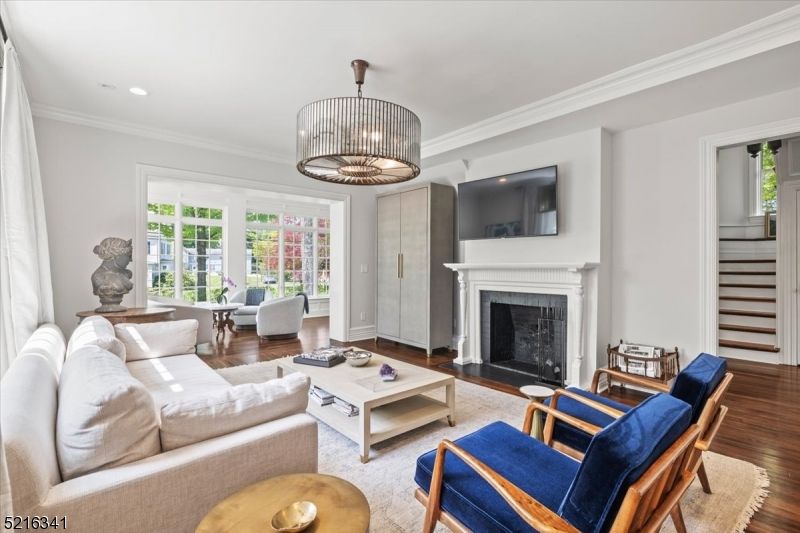 Chandelier, Fireplace, Interior, Living room, Pendant Lights, Recessed Lighting, Wood Texture Flooring