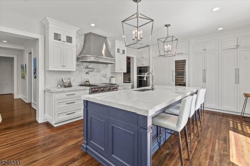 Interior, Kitchen, Marble Walls, Pendant Lights, Recessed Lighting, Stainless Steel Appliances, Wood Texture Flooring