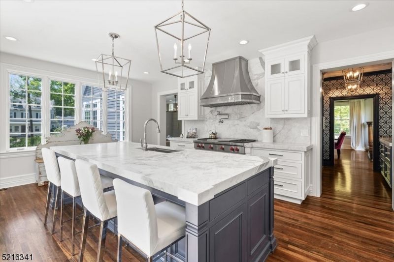 Interior, Kitchen, Marble Walls, Pendant Lights, Recessed Lighting, Stainless Steel Appliances, Wood Texture Flooring