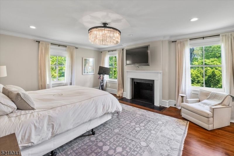 Bedroom, Chandelier, Fireplace, Interior, Recessed Lighting, Wood Texture Flooring