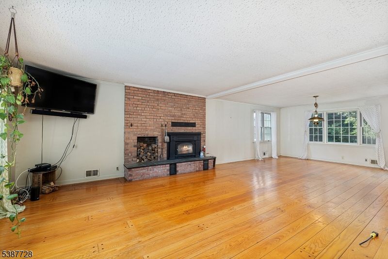 Empty room, Fireplace, Interior, Pendant Lights, Stone Walls, Wood Texture Flooring