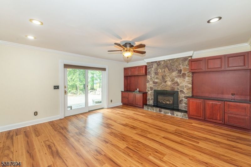Empty room, Fireplace, Interior, Recessed Lighting, Stone Walls, Wood Texture Flooring