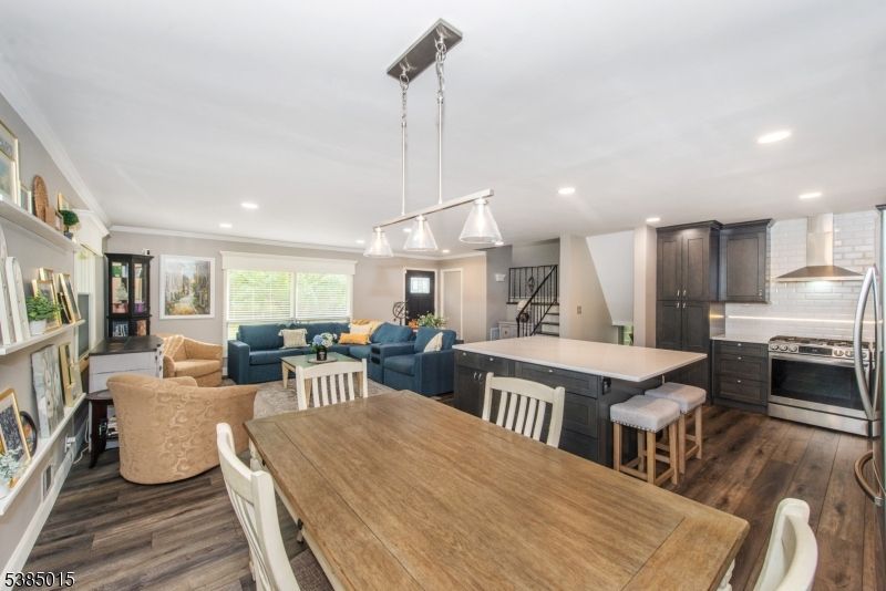 Dining room, Fireplace, Interior, Kitchen, Living room, Pendant Lights, Recessed Lighting, Stainless Steel Appliances, Wood Texture Flooring