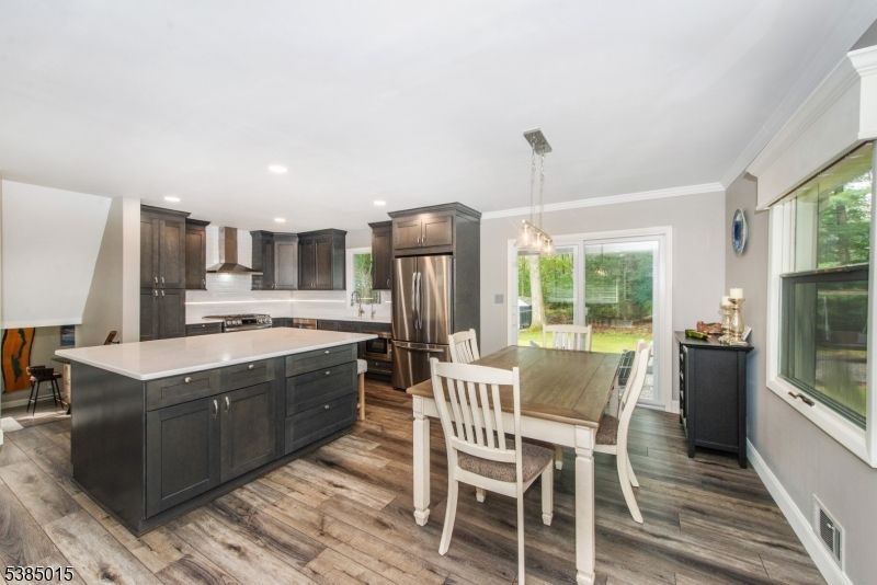 Dining room, Interior, Kitchen, Pendant Lights, Recessed Lighting, Stainless Steel Appliances, Wood Texture Flooring