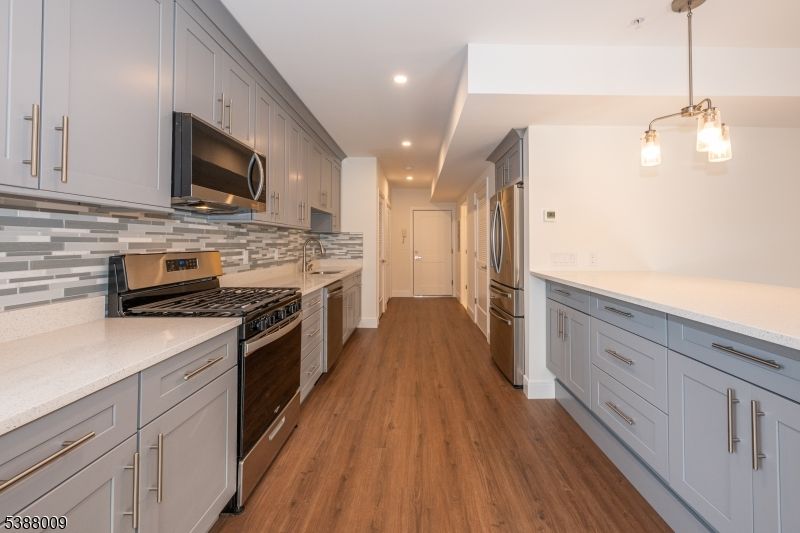 Interior, Kitchen, Pendant Lights, Recessed Lighting, Stainless Steel Appliances, Wood Texture Flooring