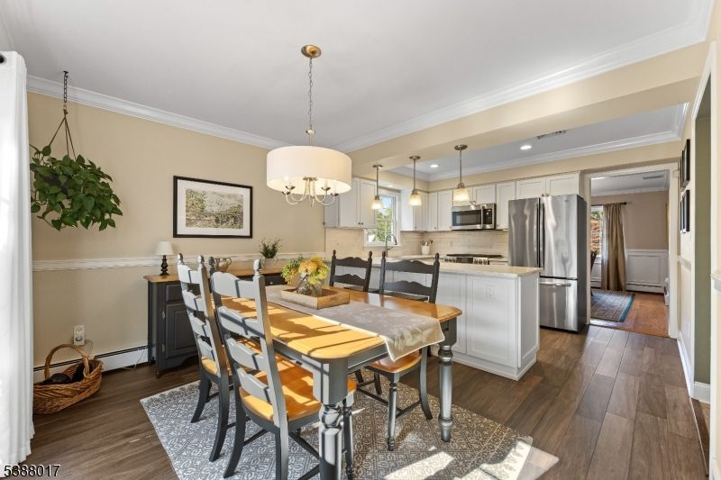 Chandelier, Dining room, Interior, Kitchen, Pendant Lights, Recessed Lighting, Stainless Steel Appliances, Wood Texture Flooring