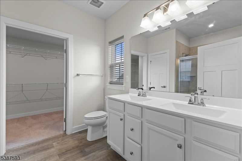 Bathroom, Dual Sink Vanities, Interior, Recessed Lighting, Wood Texture Flooring