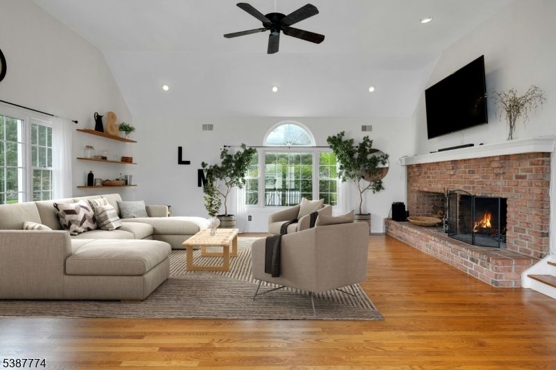 Fireplace, Interior, Living room, Recessed Lighting, Stone Walls, Wood Texture Flooring