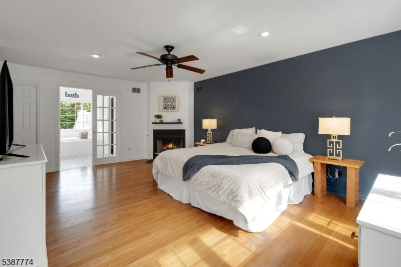 Bedroom, Fireplace, Interior, Recessed Lighting, Wood Texture Flooring