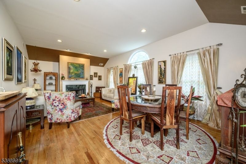 Dining room, Fireplace, Interior, Living room, Recessed Lighting, Wood Texture Flooring