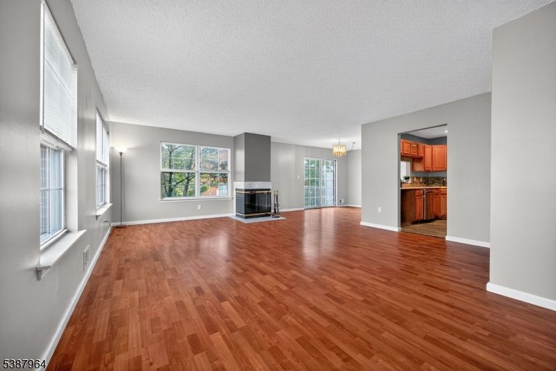 Chandelier, Empty room, Fireplace, Interior, Kitchen, Wood Texture Flooring
