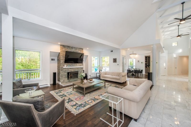 Dining room, Fireplace, Interior, Living room, Marble, Pendant Lights, Recessed Lighting, Stone Walls, Wood Texture Flooring