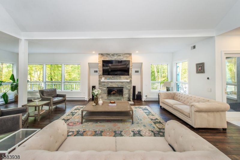 Fireplace, Interior, Living room, Recessed Lighting, Stone Walls, Wood Texture Flooring