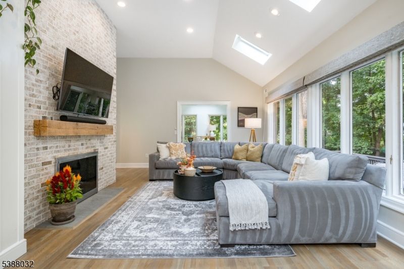 Fireplace, Interior, Living room, Recessed Lighting, Stone Walls, Wood Texture Flooring