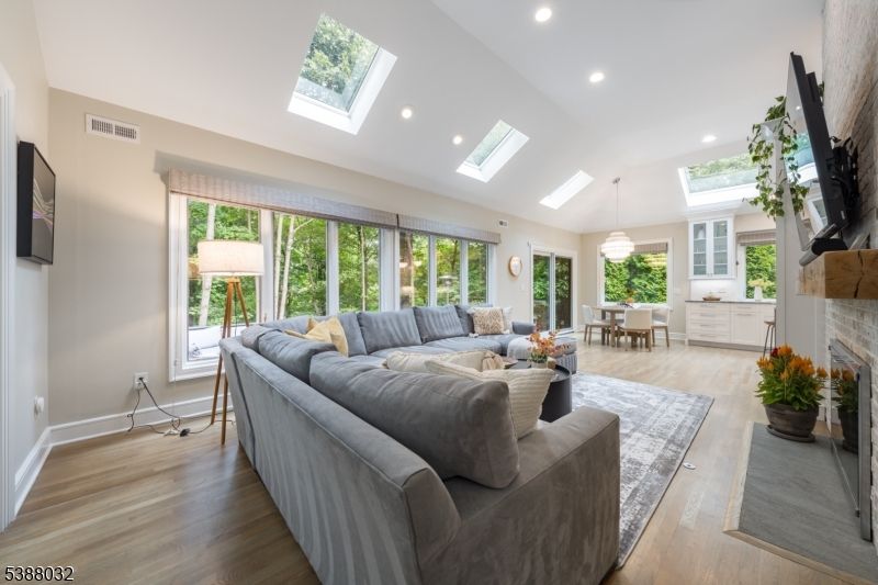 Dining room, Fireplace, Interior, Living room, Pendant Lights, Recessed Lighting, Wood Texture Flooring