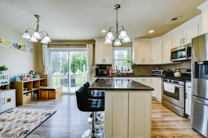 Chandelier, Interior, Kitchen, Recessed Lighting, Stainless Steel Appliances, Wood Texture Flooring