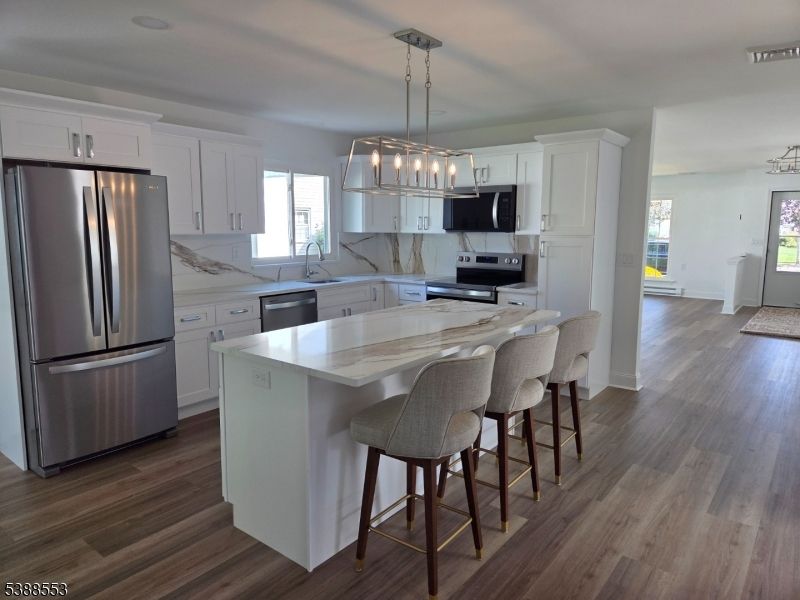Interior, Kitchen, Marble Walls, Pendant Lights, Stainless Steel Appliances, Wood Texture Flooring