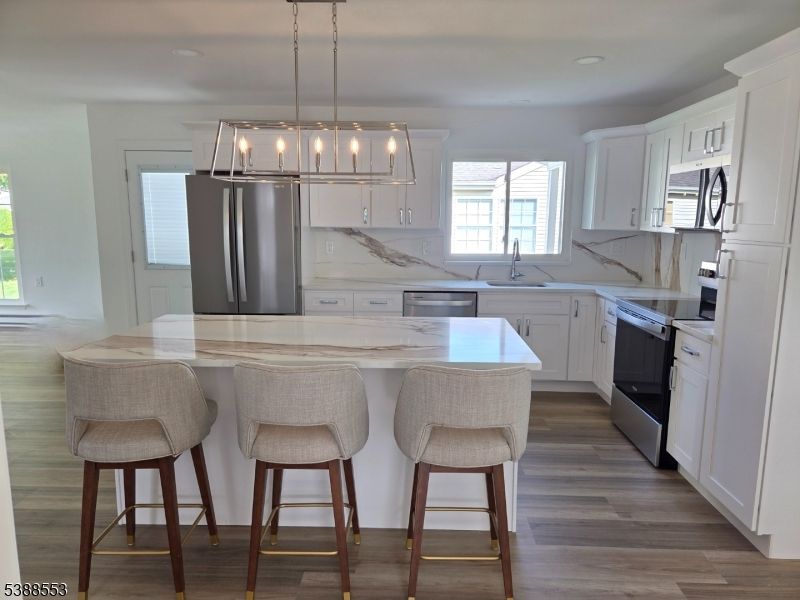 Interior, Kitchen, Marble Walls, Pendant Lights, Recessed Lighting, Stainless Steel Appliances, Wood Texture Flooring