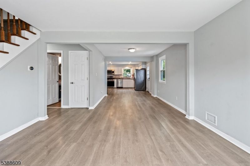 Empty room, Interior, Kitchen, Stainless Steel Appliances, Wood Texture Flooring