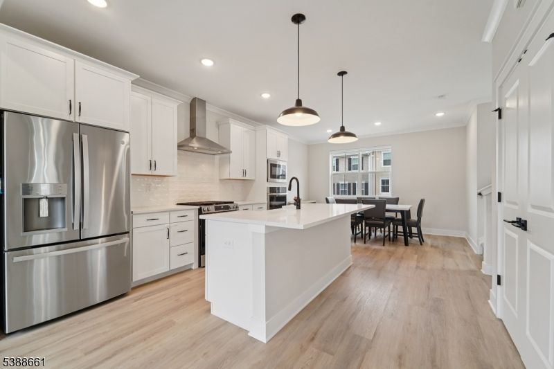 Dining room, Interior, Kitchen, Pendant Lights, Recessed Lighting, Stainless Steel Appliances, Wood Texture Flooring