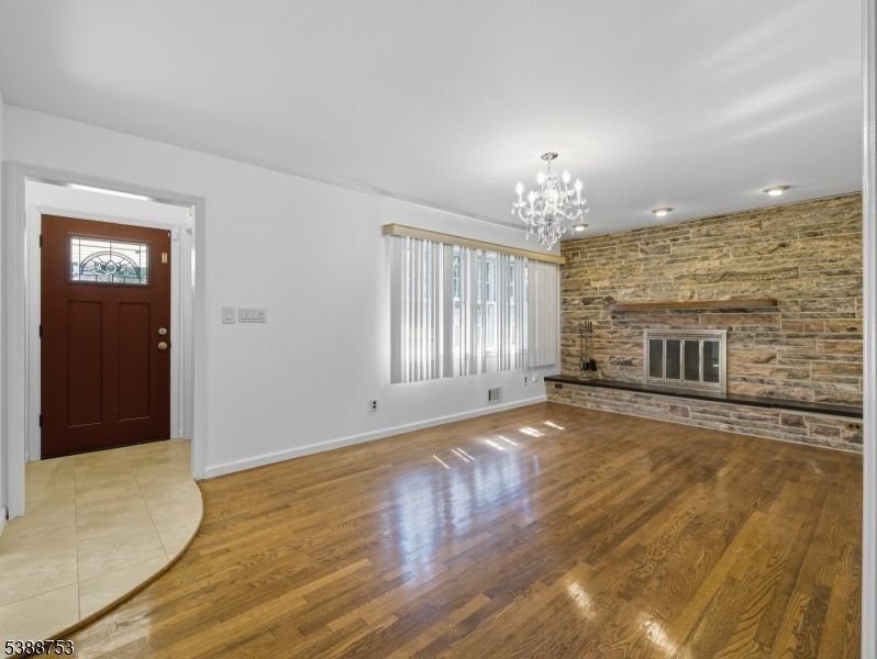 Chandelier, Empty room, Fireplace, Interior, Stone Walls, Wood Texture Flooring