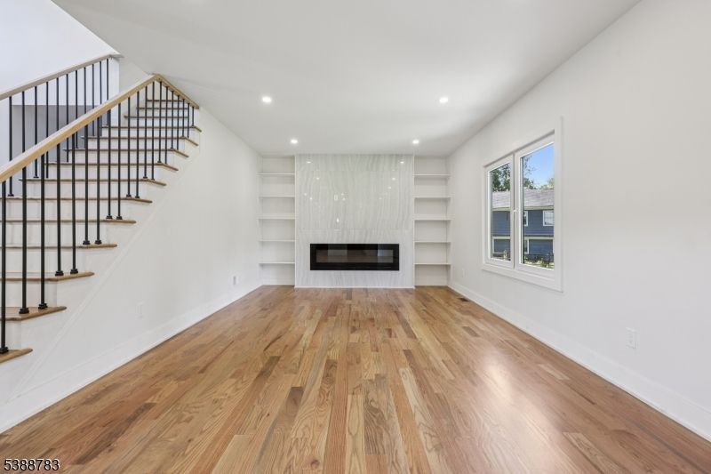 Empty room, Fireplace, Interior, Recessed Lighting, Wood Texture Flooring